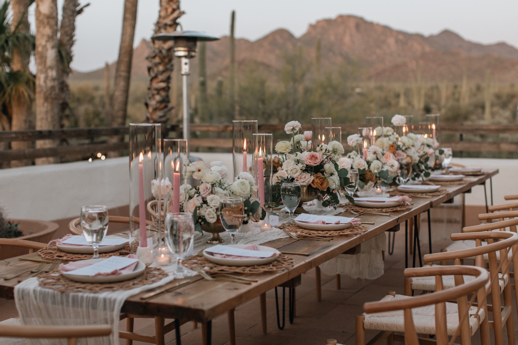 Warm wedding tablescape with floral centerpieces